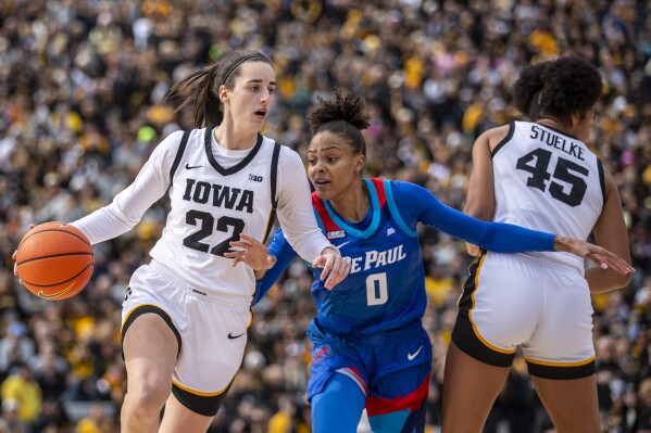 Clark s triple double highlights game at Kinnick. Women s